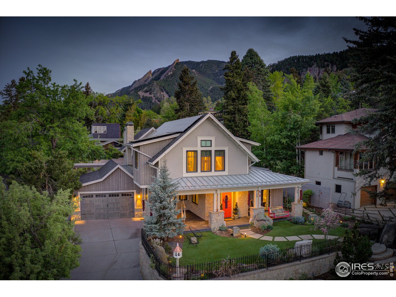 a aerial view of a house next to a yard
