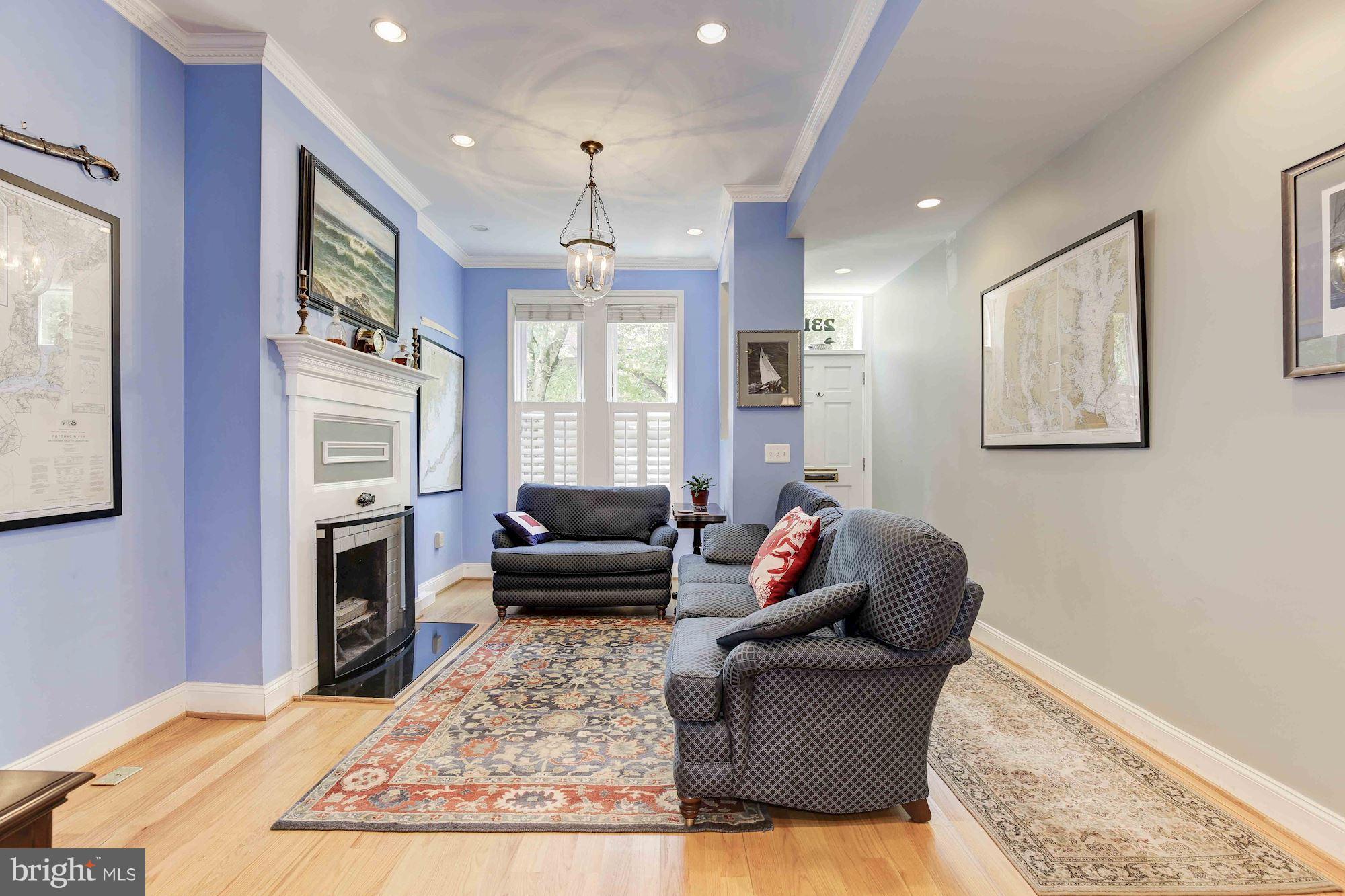 231 10th Street Northeast Washington, DC 20002 - Photo 2 of 17 a living room with furniture flat screen tv and a fireplace