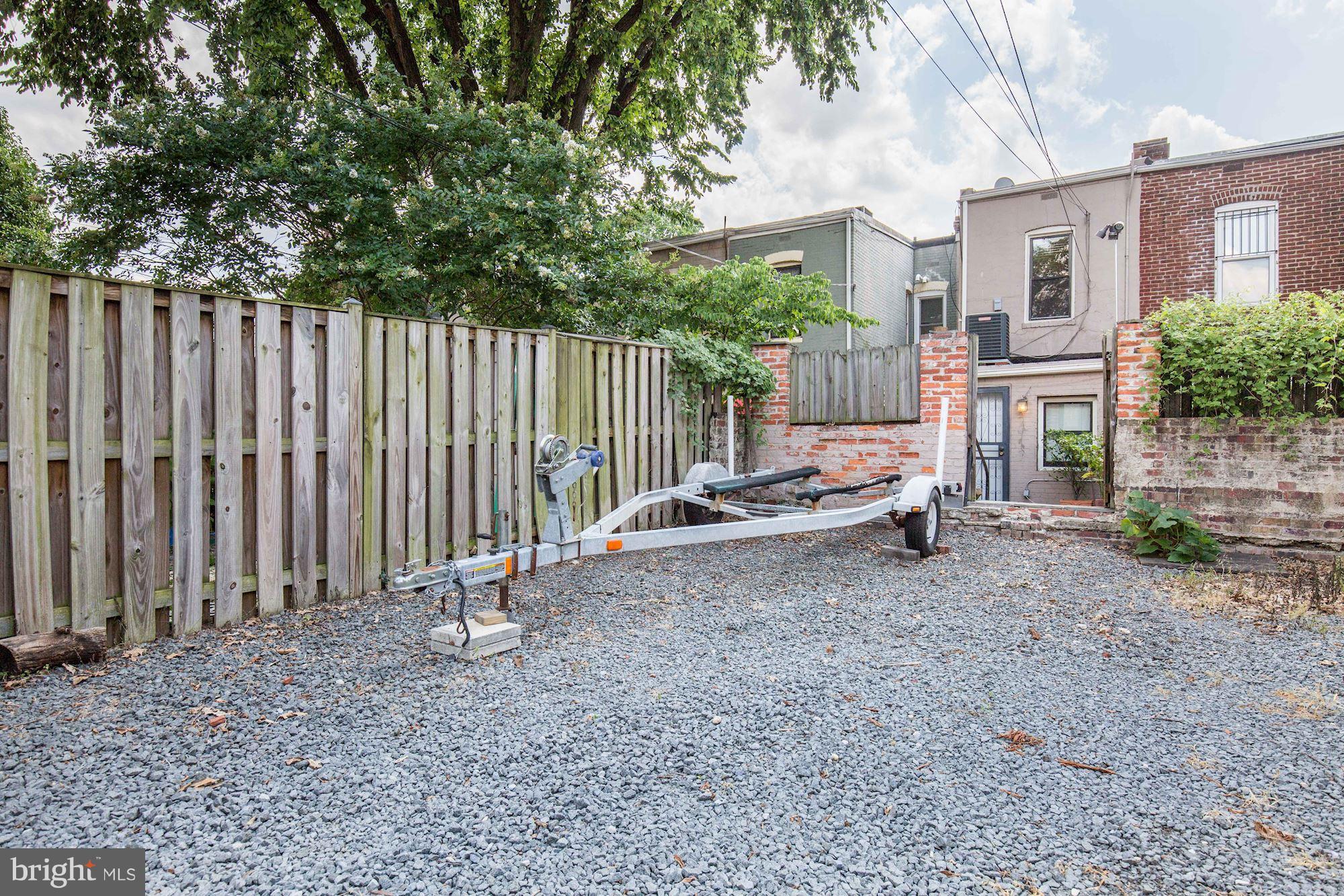 231 10th Street Northeast Washington, DC 20002 - Photo 16 of 17 a view of a house with backyard and wooden fence