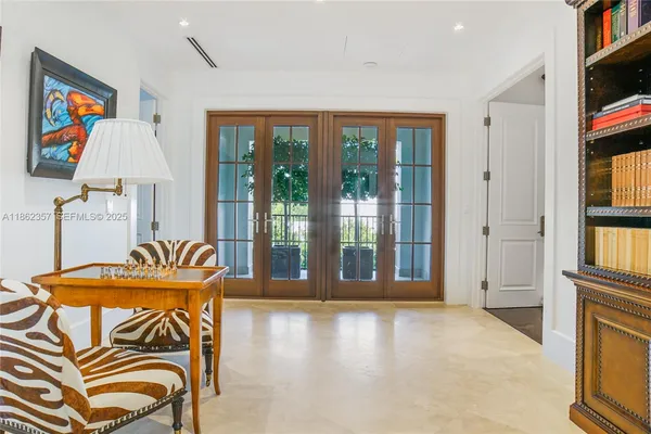 a view of a livingroom with furniture window and entryway