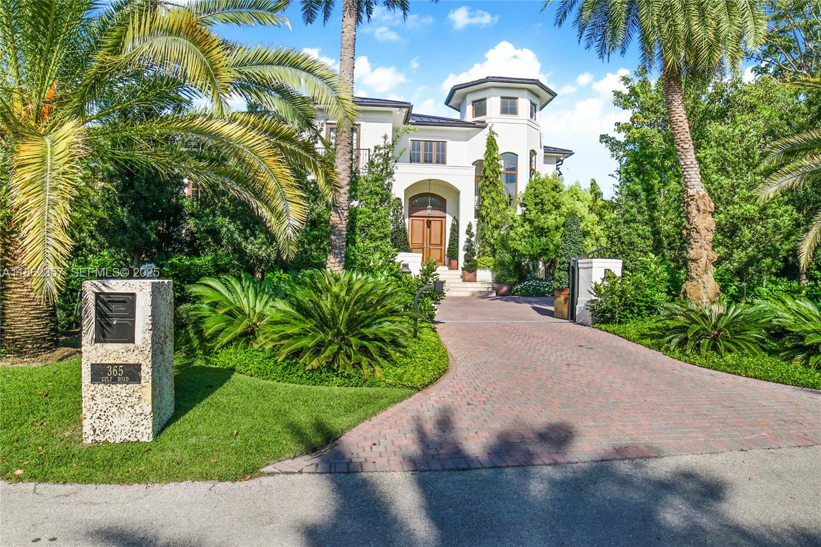 365 Gulf Road Key Biscayne, FL 33149 - Photo 2 of 29 a front view of a house with a yard