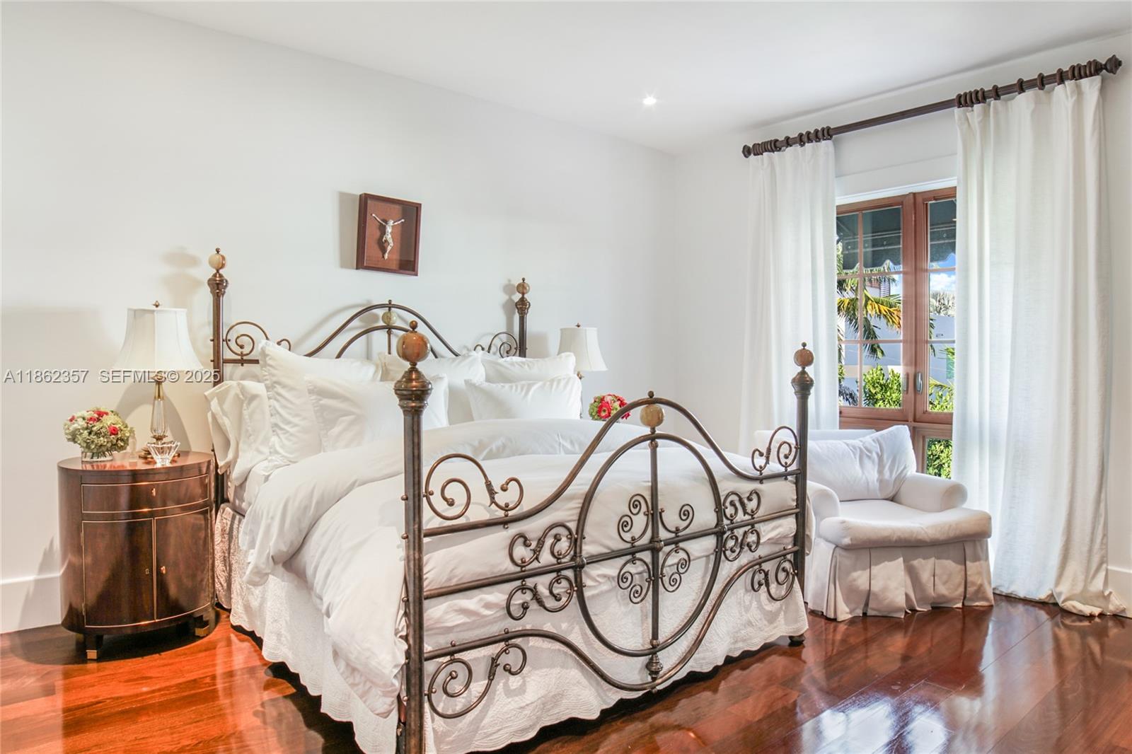 365 Gulf Road Key Biscayne, FL 33149 - Photo 21 of 29 a bedroom with furniture and a window