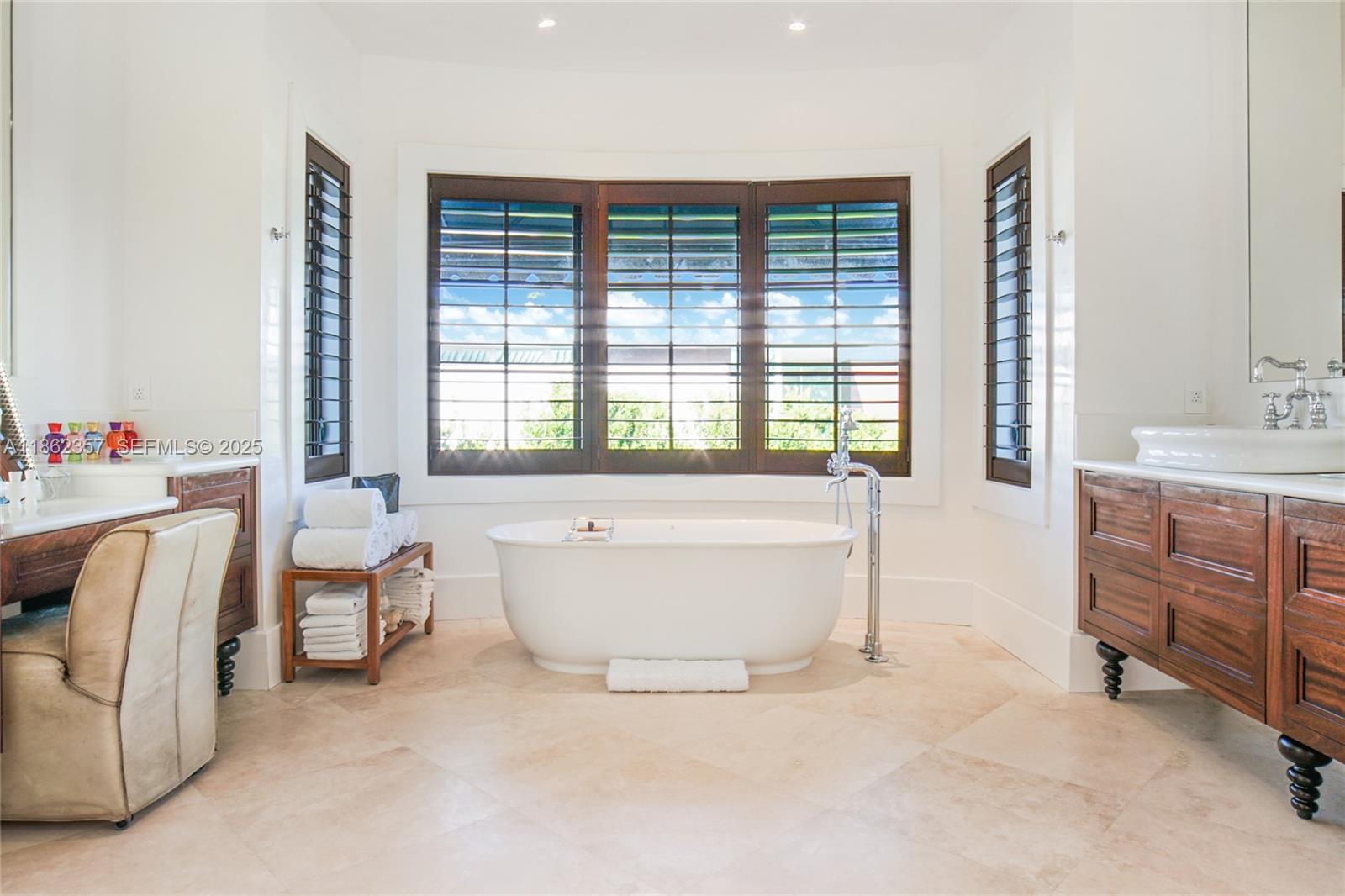 365 Gulf Road Key Biscayne, FL 33149 - Photo 24 of 29 a spacious bedroom with a bed and a large window