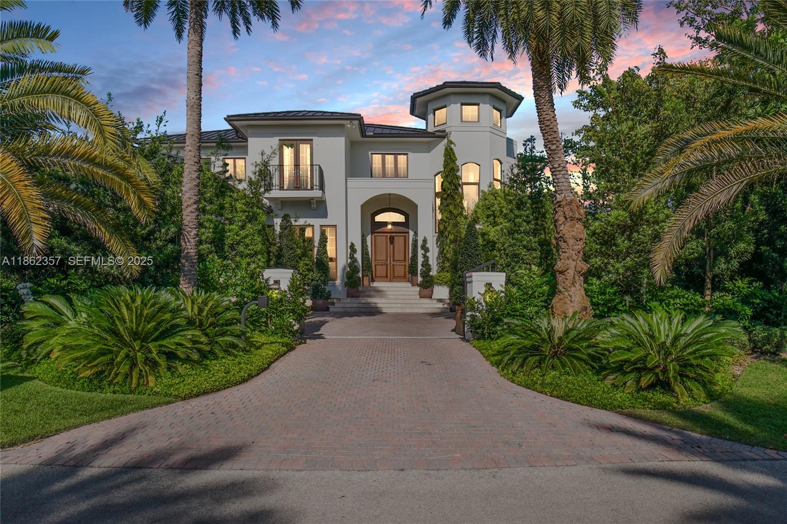 365 Gulf Road Key Biscayne, FL 33149 - Photo 29 of 29 a front view of a house with a garden