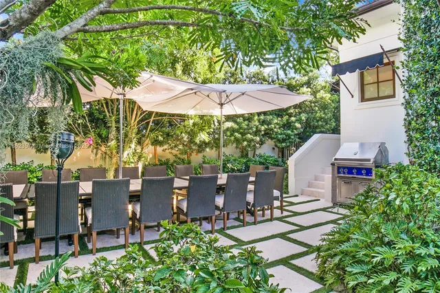 an outdoor space with furniture and umbrella