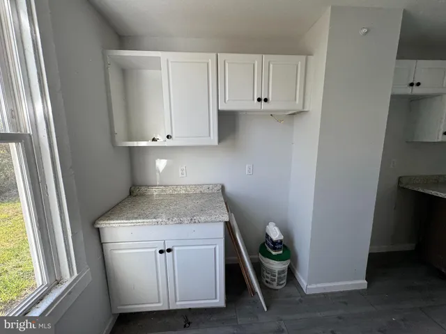 a view of cabinets and window