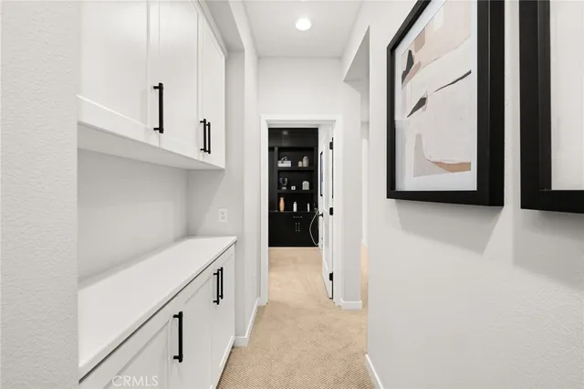 a view of an entryway with hallway