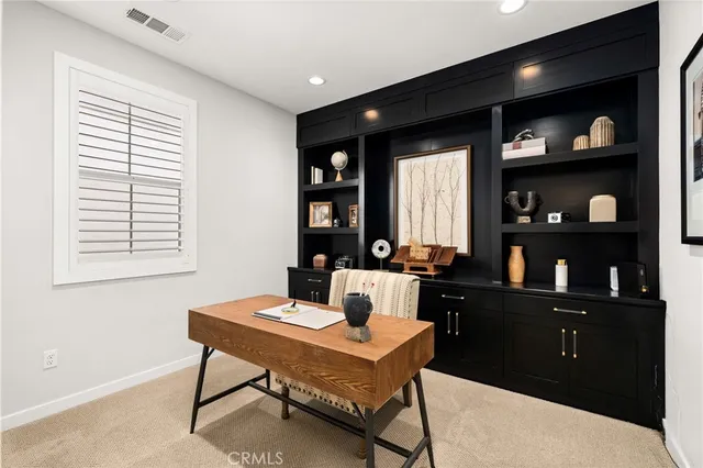 a workspace with furniture and window