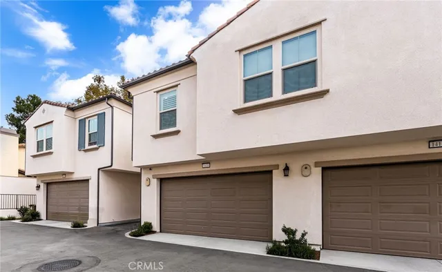 a front view of a house with garage