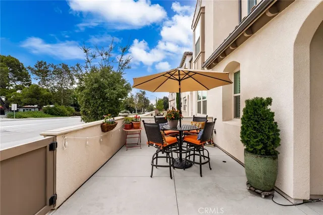 a view of backyard with seating space and trees