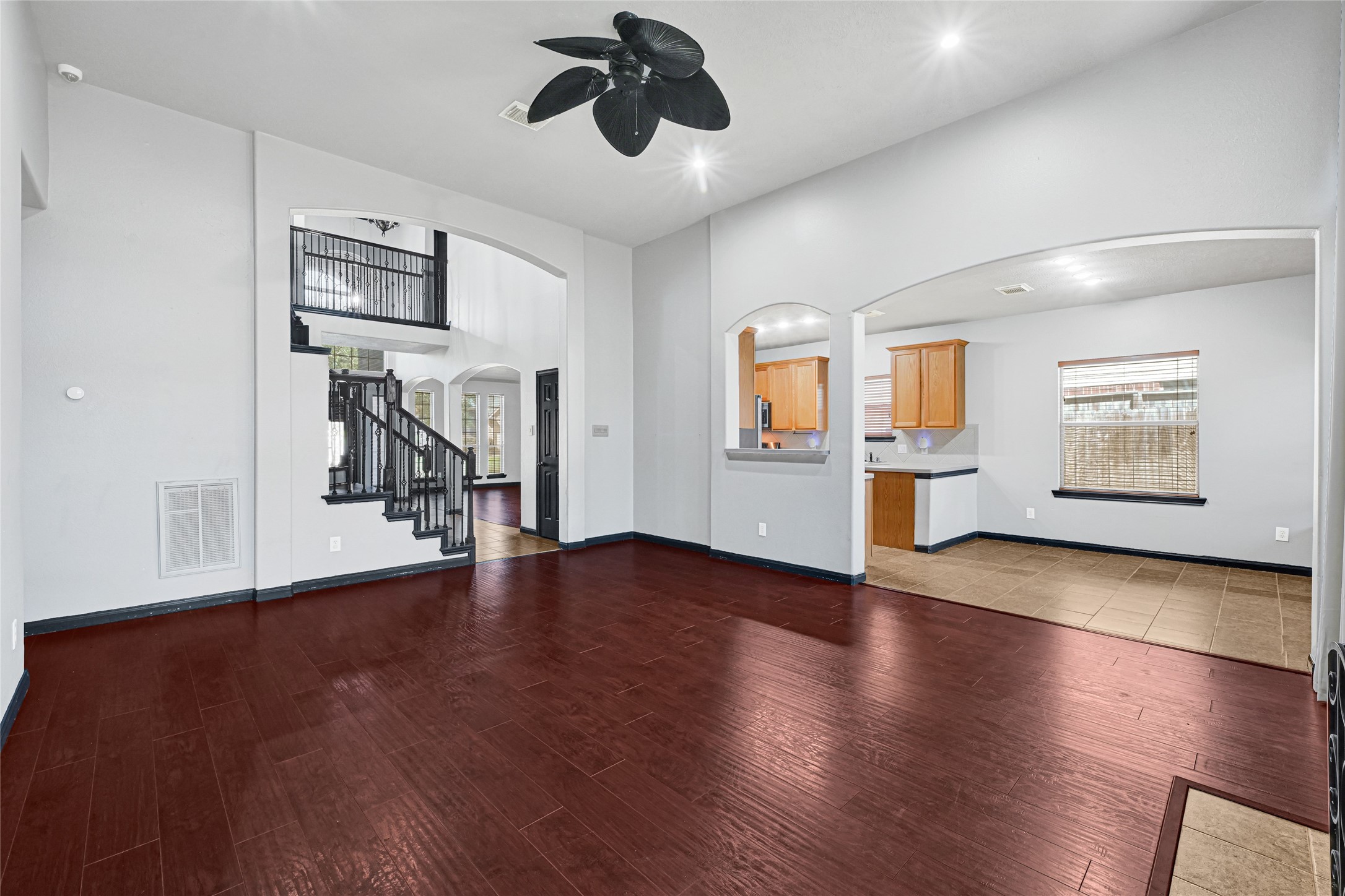 8514 Discus Drive Humble, TX 77346 - Photo 11 of 32 a view of a livingroom with hardwood floor and a ceiling fan