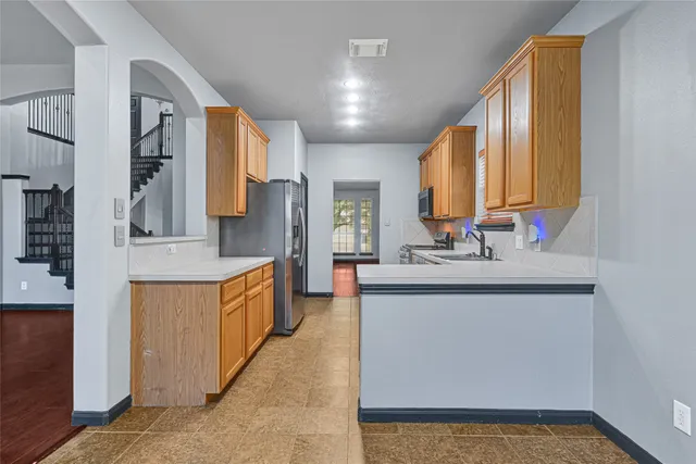 a spacious bathroom with a sink double vanity and a mirror