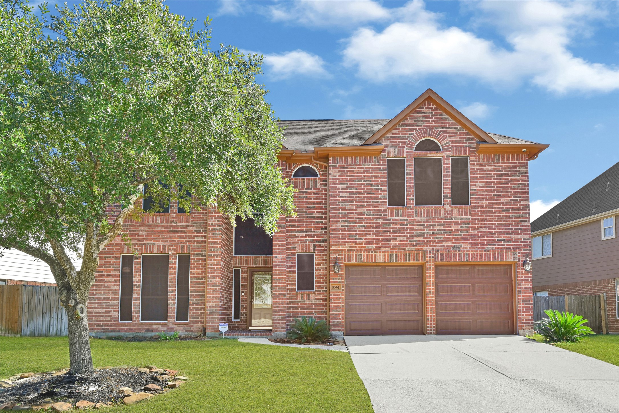 8514 Discus Drive Humble, TX 77346 - Photo 2 of 32 a front view of a house with garden