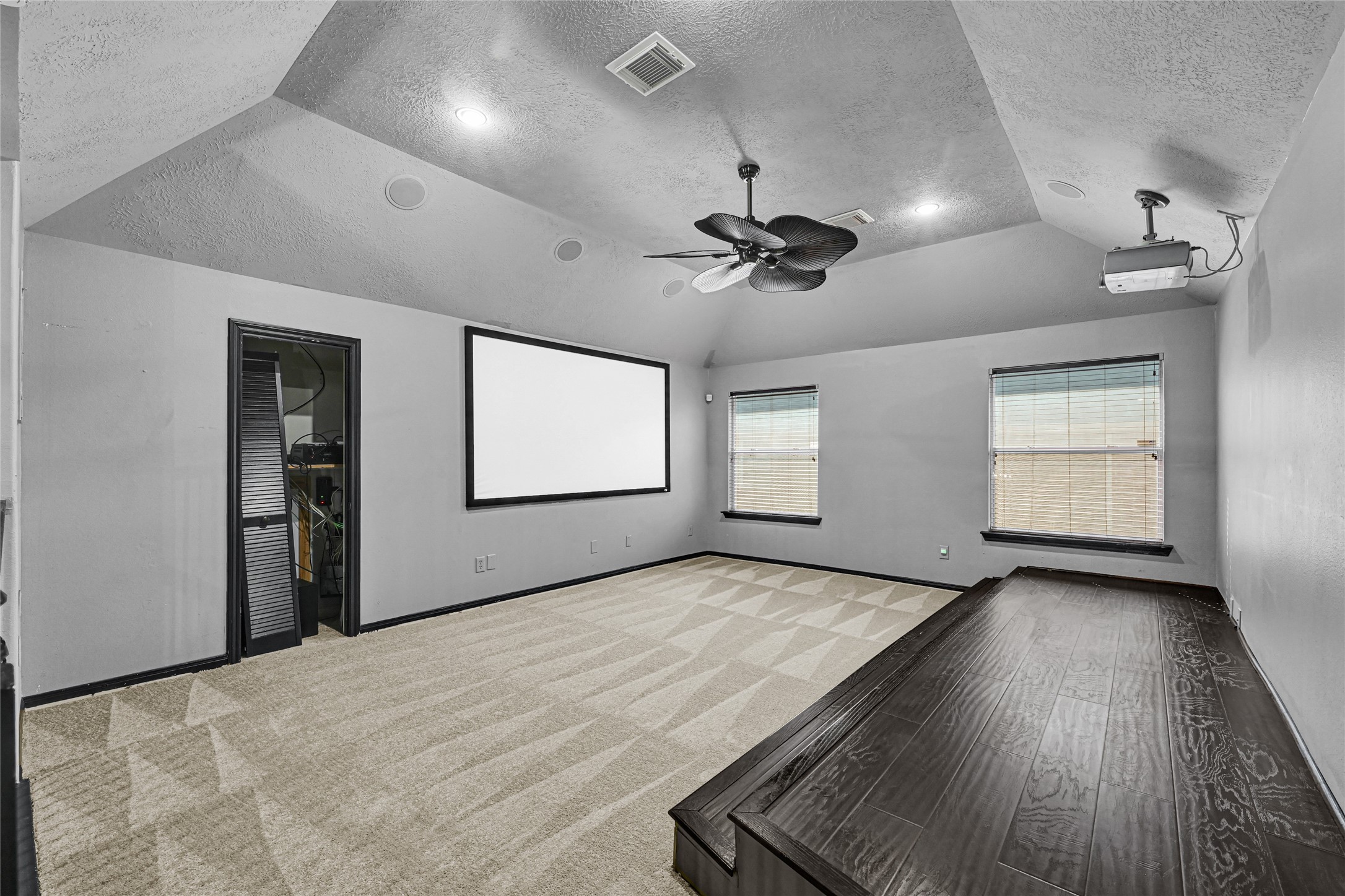 8514 Discus Drive Humble, TX 77346 - Photo 22 of 32 an empty room with windows and ceiling fan