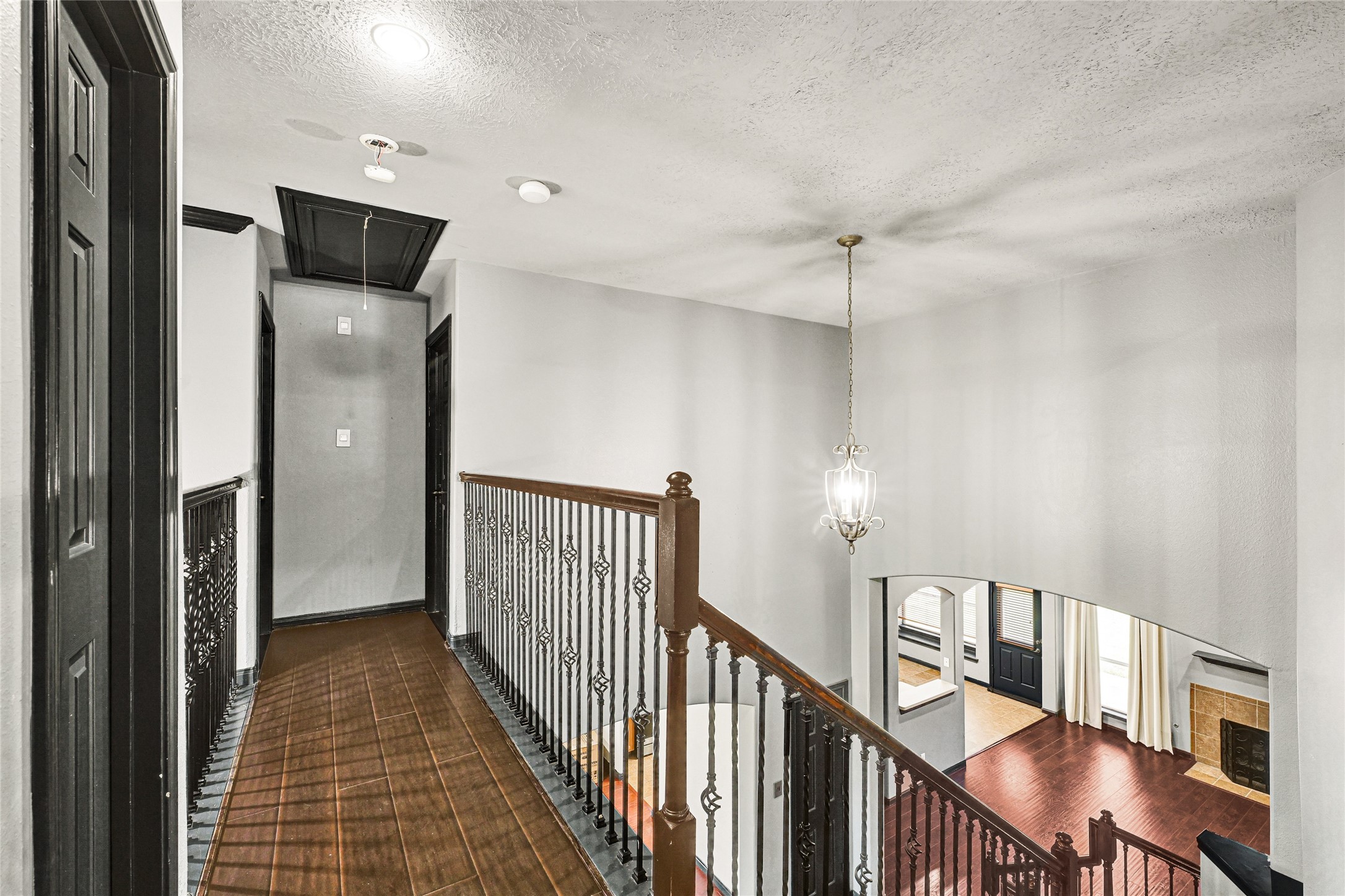 8514 Discus Drive Humble, TX 77346 - Photo 23 of 32 a view of a hallway with entryway wooden floor and windows
