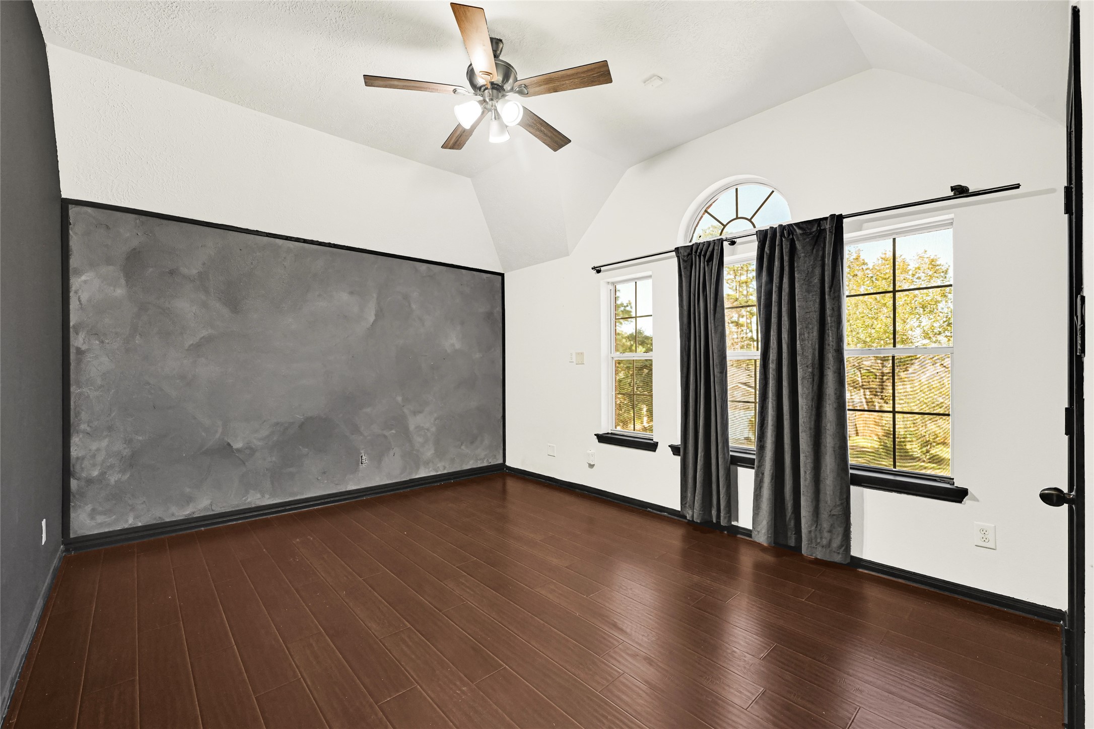 8514 Discus Drive Humble, TX 77346 - Photo 25 of 32 an empty room with wooden floor and windows