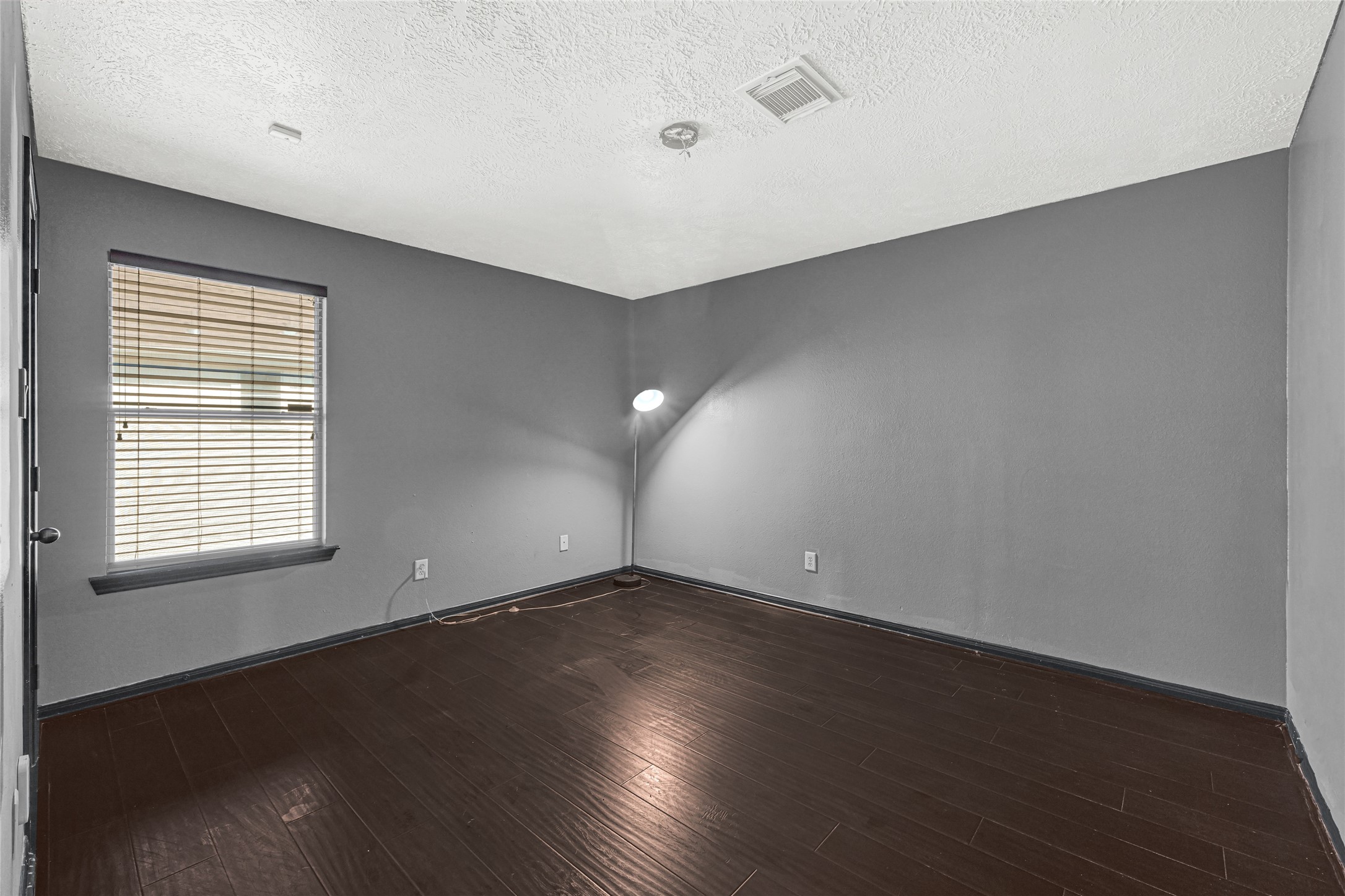 8514 Discus Drive Humble, TX 77346 - Photo 29 of 32 an empty room with wooden floor and windows