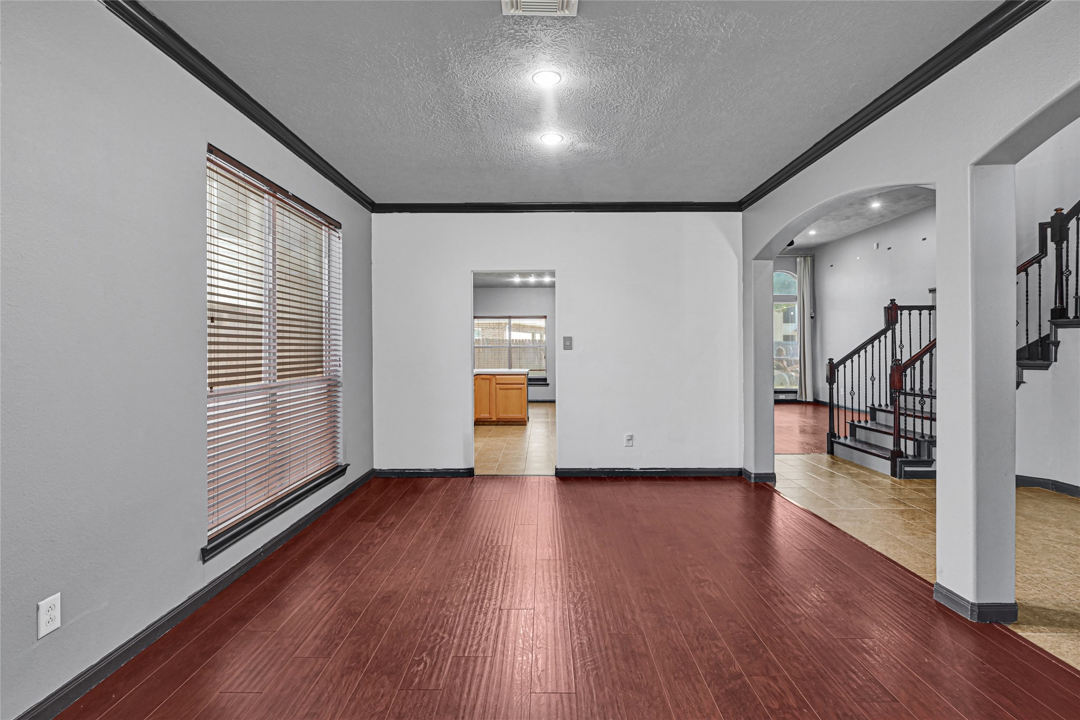 8514 Discus Drive Humble, TX 77346 - Photo 7 of 32 wooden floor in an empty room with a window