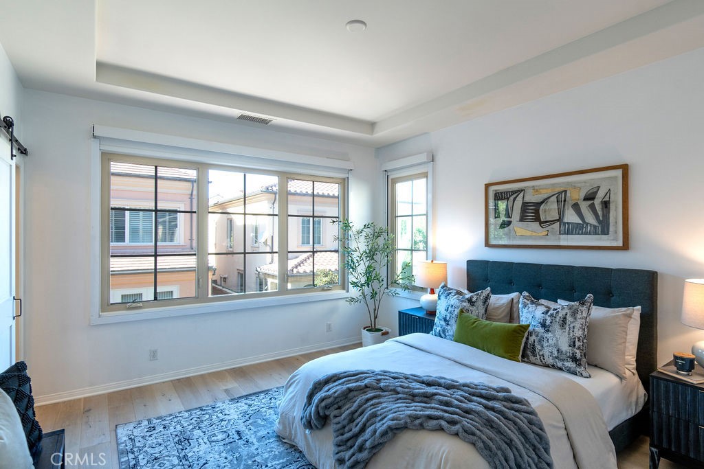 58 Cipresso Irvine, CA 92618 - Photo 14 of 34 a bedroom with bed and a window