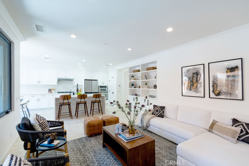 58 Cipresso Irvine, CA 92618 - Photo 6 of 34 a living room with furniture and large window
