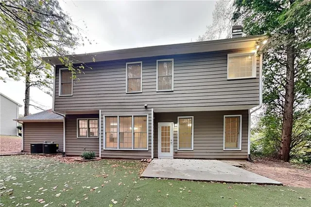 a front view of a house with garage
