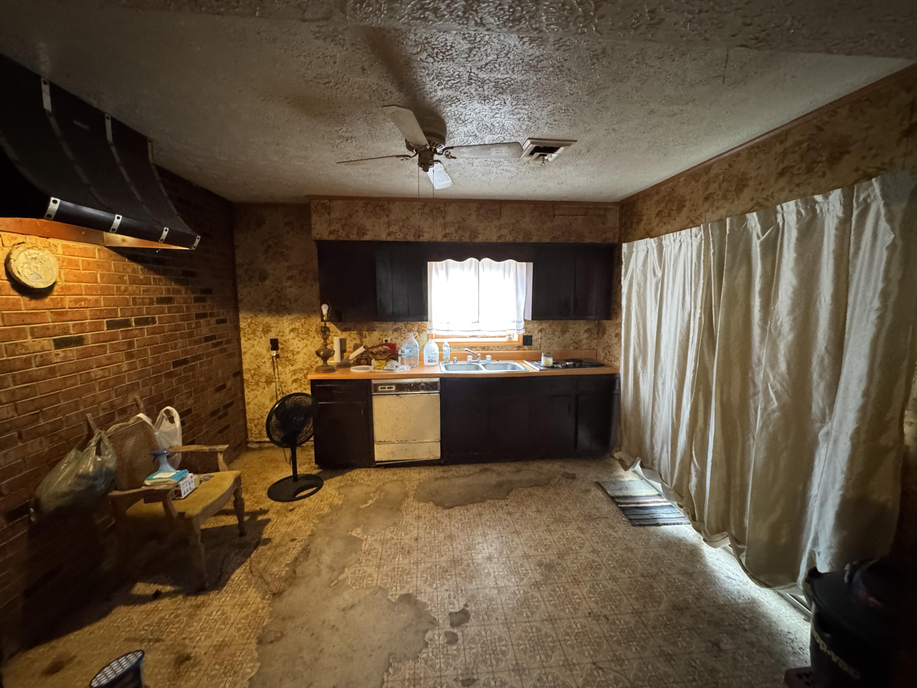 5341 Robinson Tract Road Pulaski, VA 24301 - Photo 16 of 32 a kitchen with sink refrigerator and window