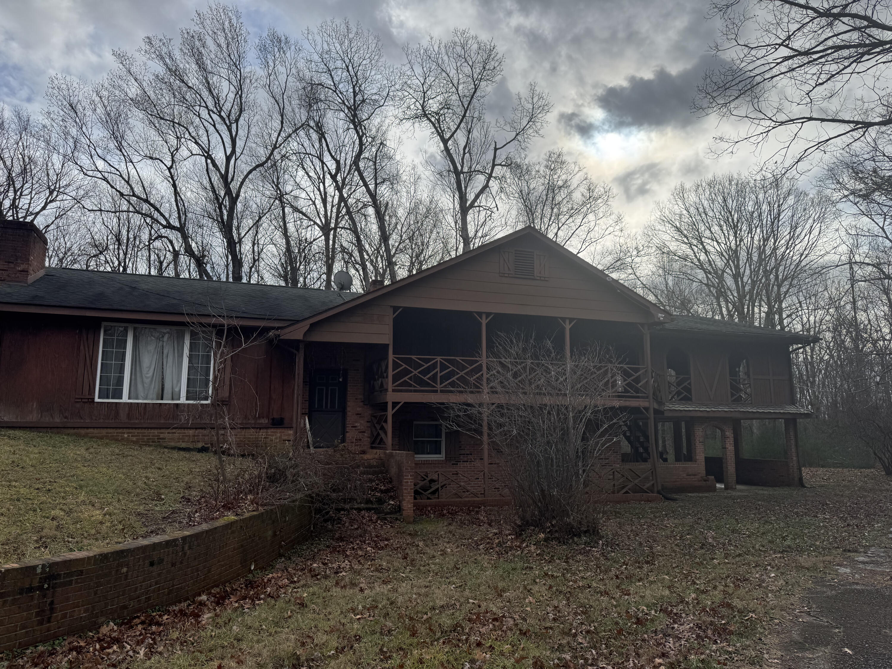 5341 Robinson Tract Road Pulaski, VA 24301 - Photo 2 of 32 a front view of a house with garden