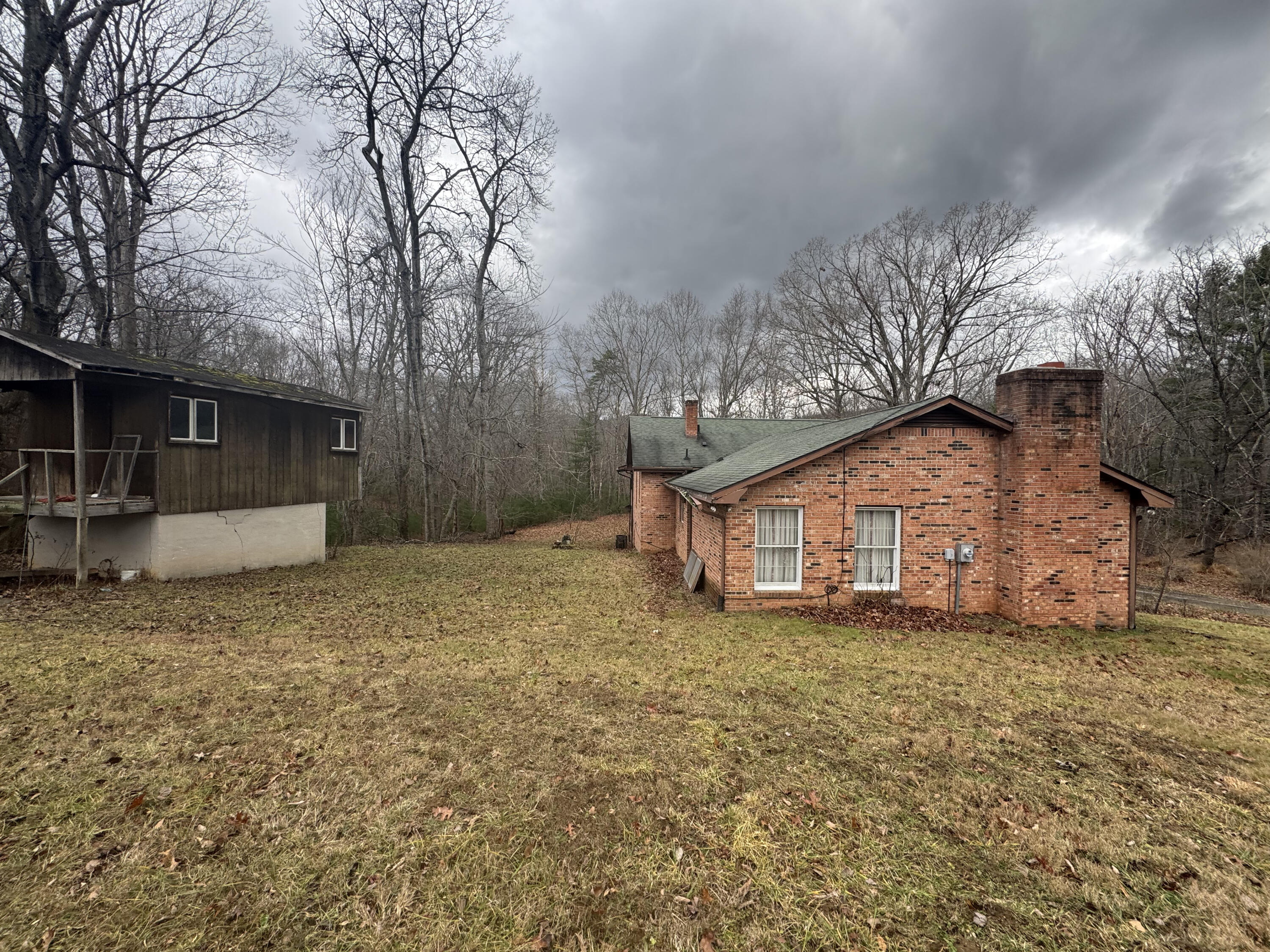 5341 Robinson Tract Road Pulaski, VA 24301 - Photo 28 of 32 a view of a house with a yard and garage