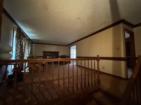a view of staircase with lots of wooden floor