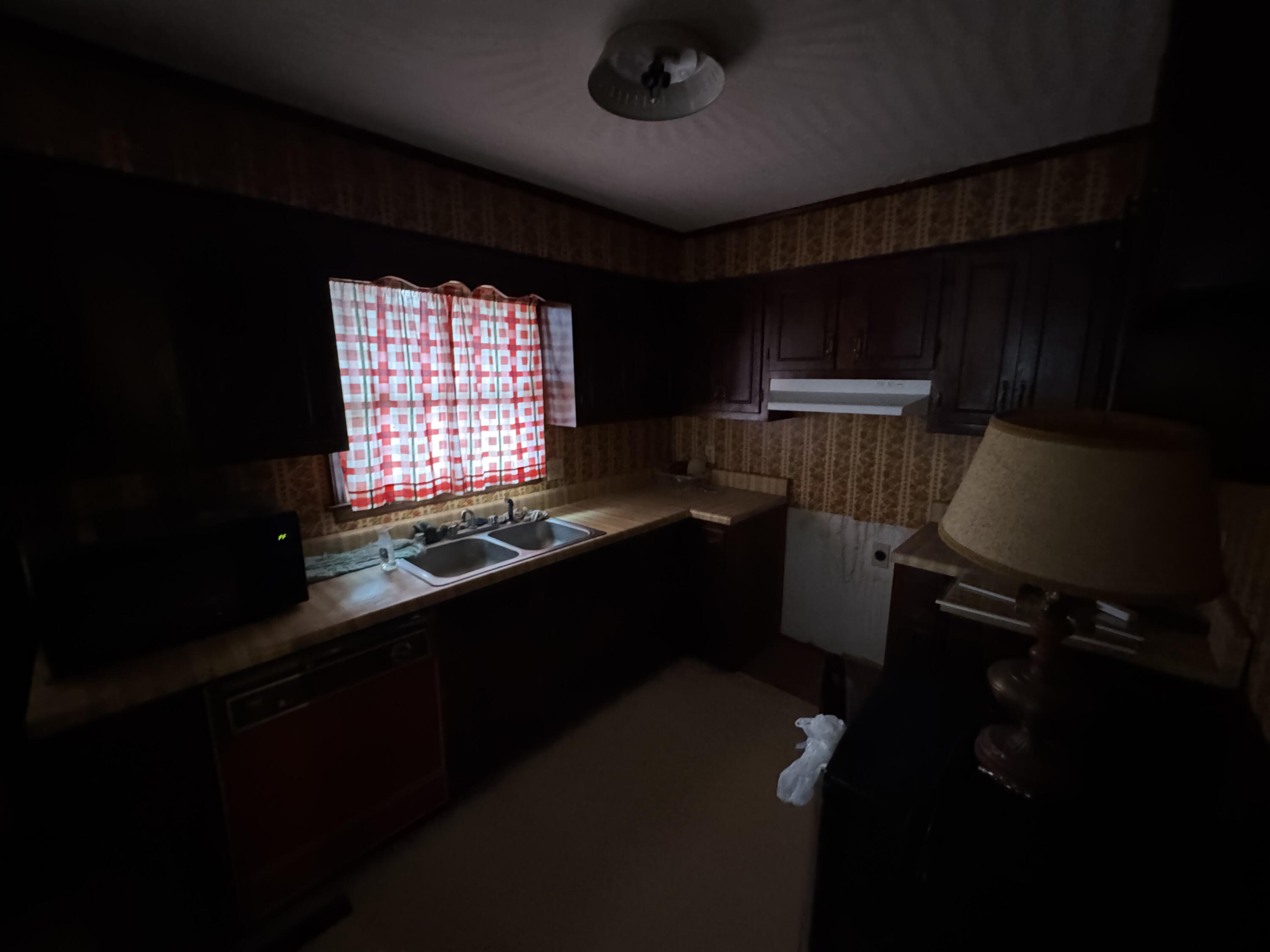 5341 Robinson Tract Road Pulaski, VA 24301 - Photo 7 of 32 a kitchen with a sink a stove and a window