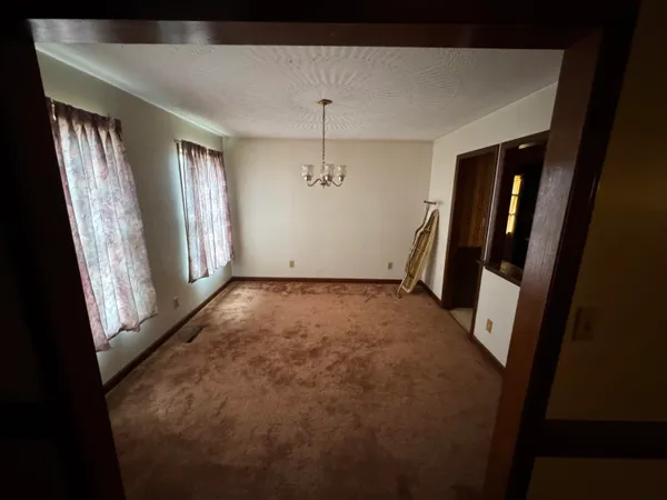 a view of empty room with windows