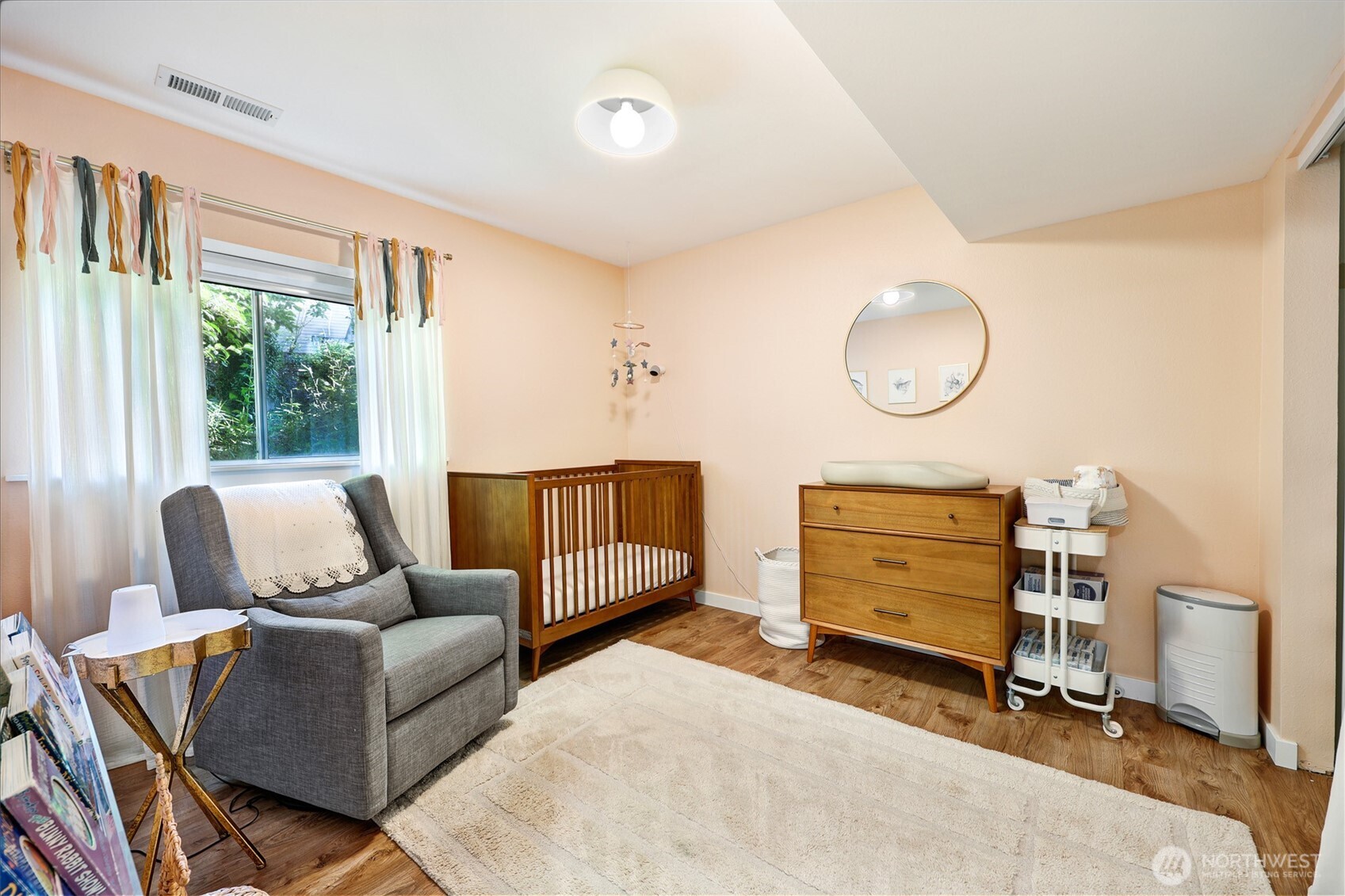 5126 South Garden Loop Road, Unit 11 Seattle, WA 98118 - Photo 25 of 36 a bedroom with furniture and a window