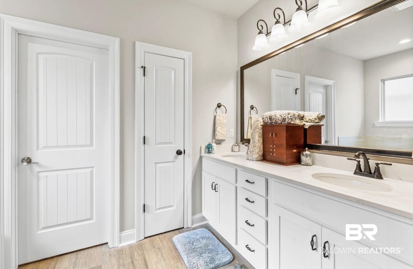 10126 Chipper Lane Foley, AL 36535 - Photo 17 of 30 Bathroom featuring double vanity and light wood finished floors