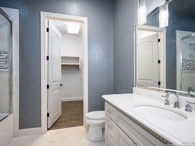 a view of a kitchen cabinets and wooden floor