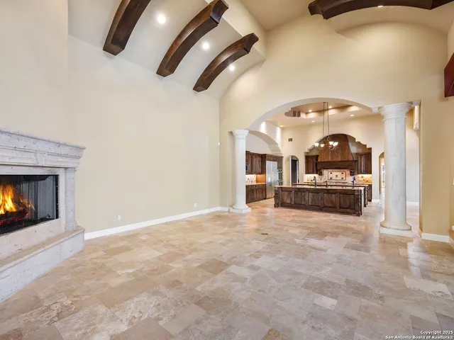 a view of a kitchen with a sink and a fireplace