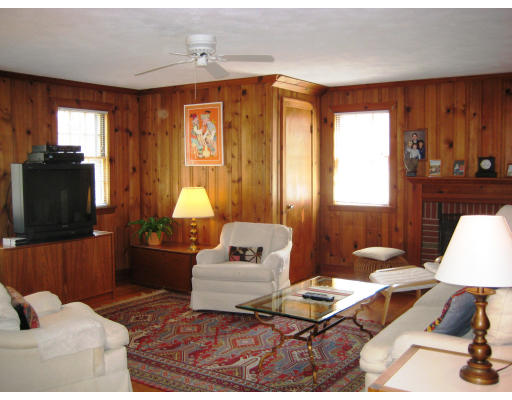 29 Eaton Road Needham, MA 02492 - Photo 5 of 15 a living room with furniture and a flat screen tv