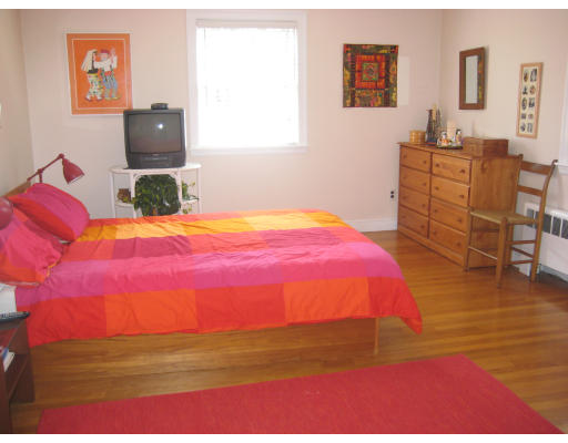 29 Eaton Road Needham, MA 02492 - Photo 7 of 15 a bedroom with a bed and wooden floor