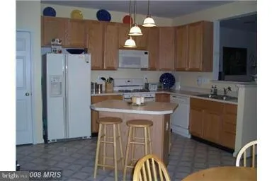 a kitchen with a sink cabinets and window