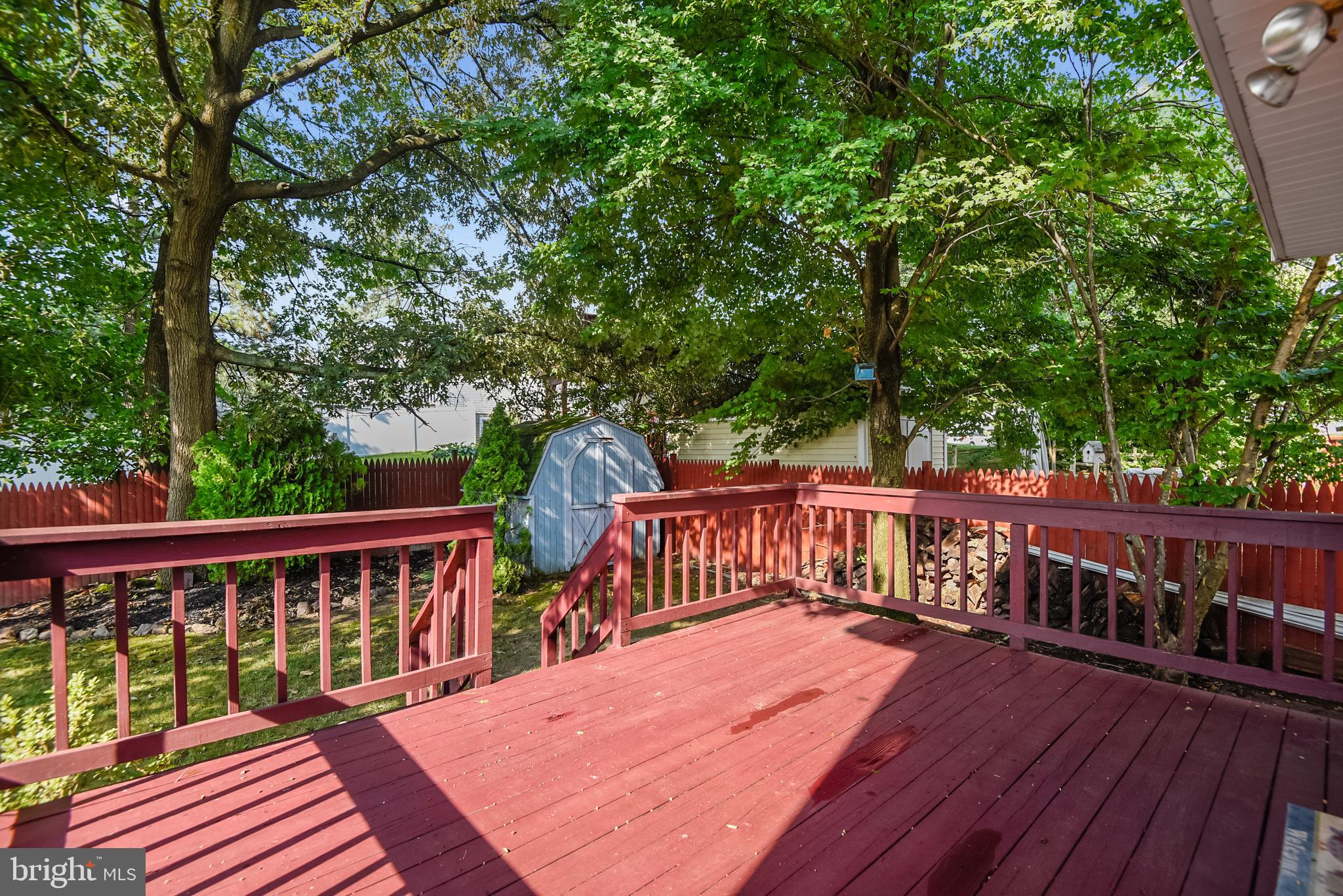 7776 Old House Road Pasadena, MD 21122 - Photo 34 of 41 Back deck leading into yard