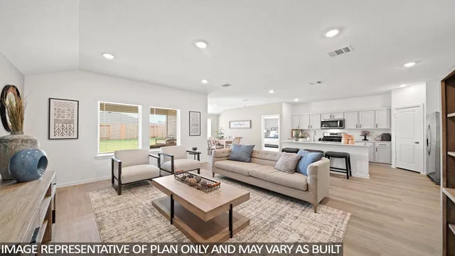 a living room with furniture and a table