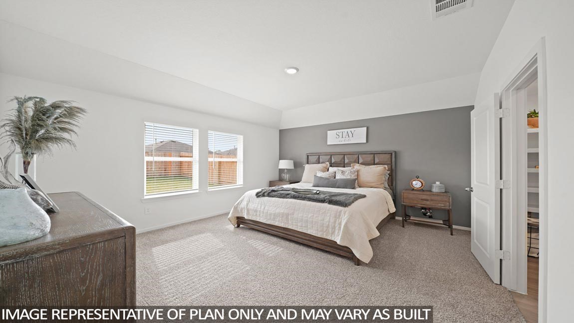 14266 Moon Flower Drive Splendora, TX 77372 - Photo 6 of 18 a bedroom with a bed and a window