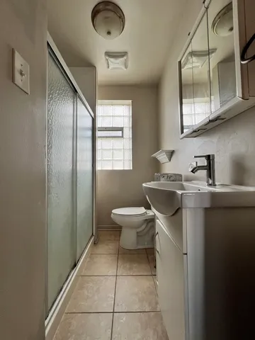 a room with water heater and a washer dryer