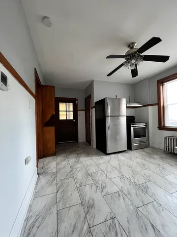 a view of a kitchen with a sink and a stove