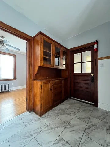 a view of wooden floor and windows in a room