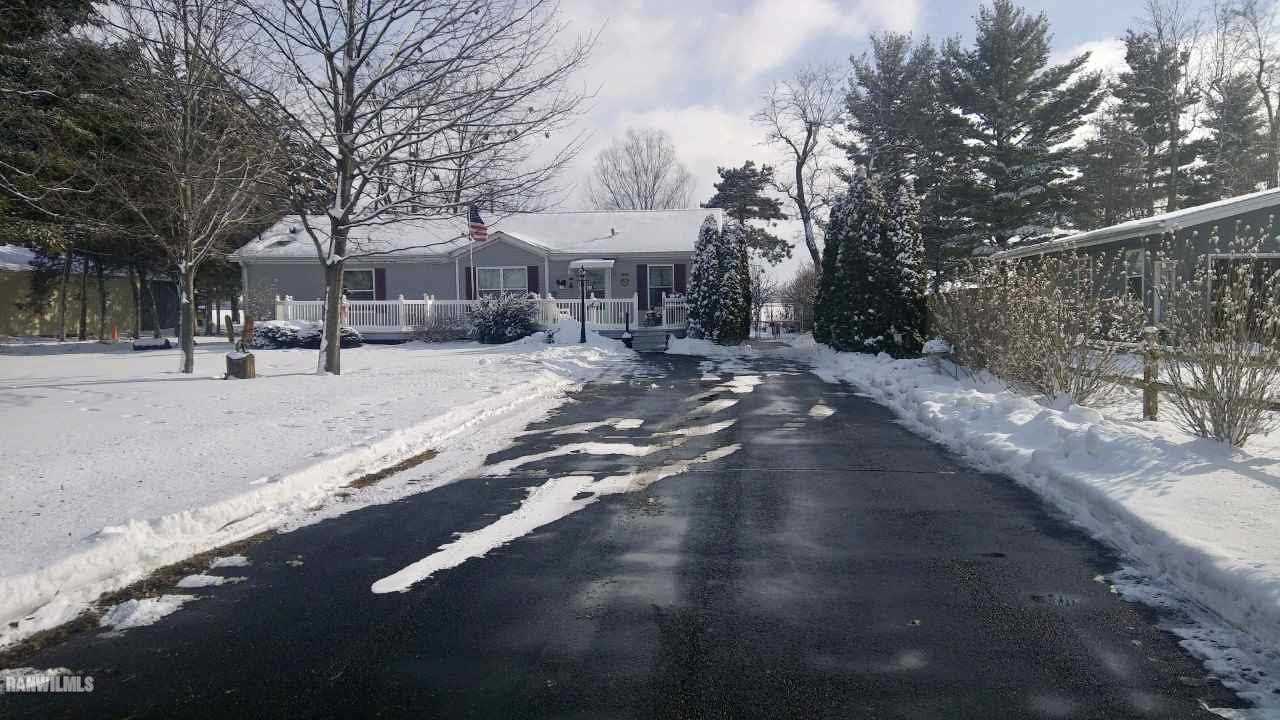 6639 Riverview Road Thomson, IL 61285 - Photo 19 of 20 a view of a street with a building in the background