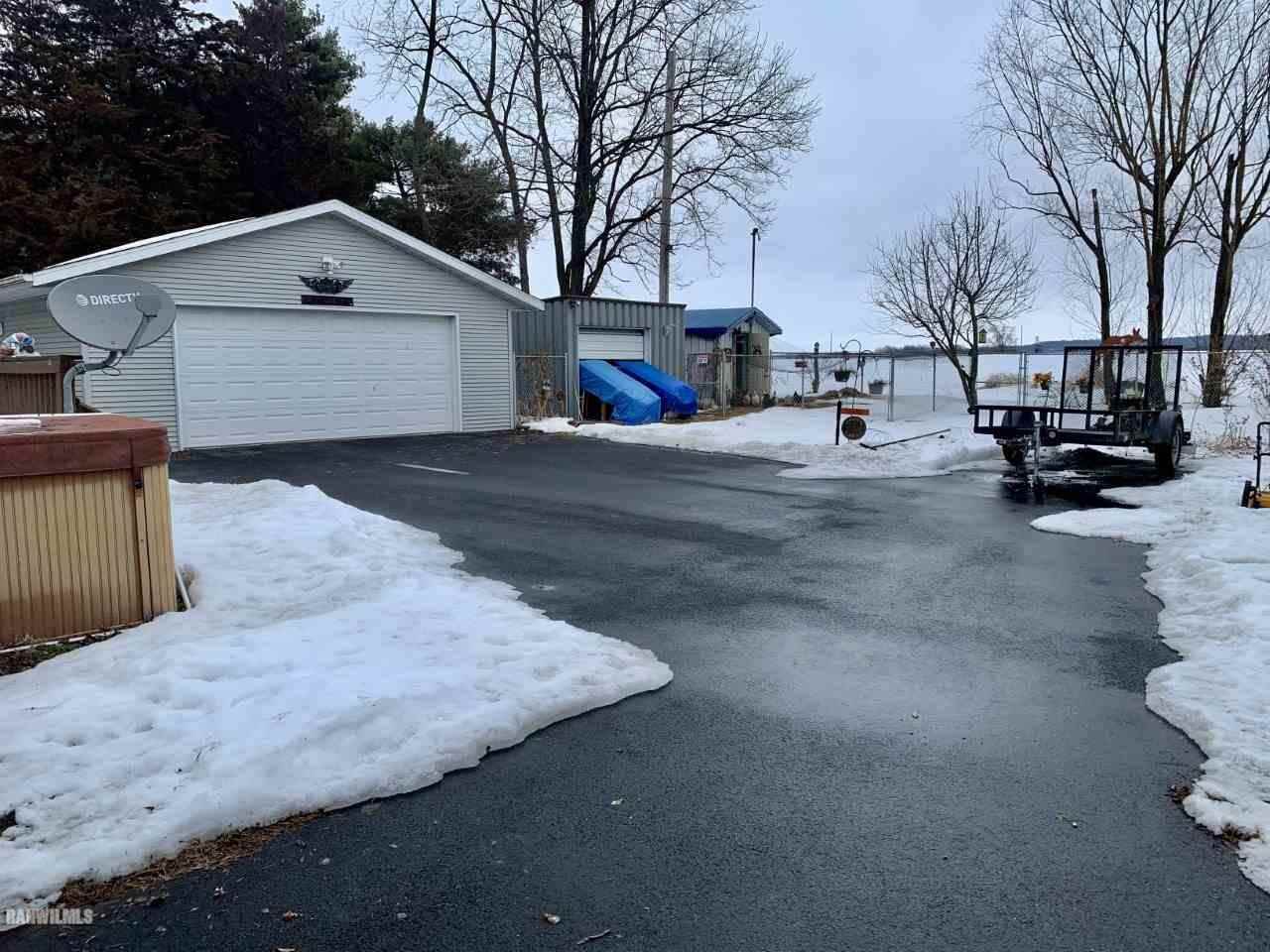 6639 Riverview Road Thomson, IL 61285 - Photo 20 of 20 a view of a house with snow on the road