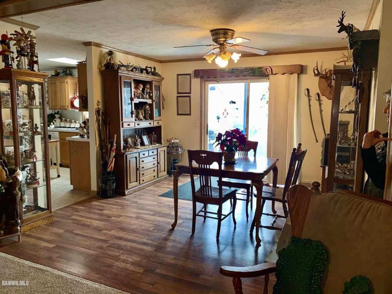 6639 Riverview Road Thomson, IL 61285 - Photo 5 of 20 a view of a dining room with furniture and a chandelier