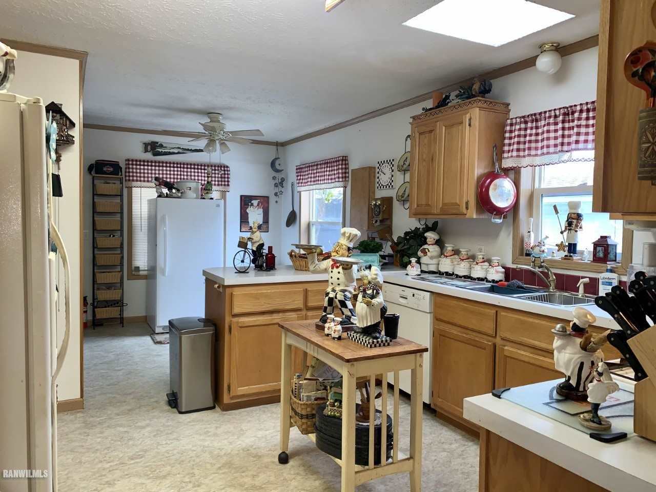 6639 Riverview Road Thomson, IL 61285 - Photo 7 of 20 a kitchen with stainless steel appliances kitchen island granite countertop a refrigerator and a stove top oven