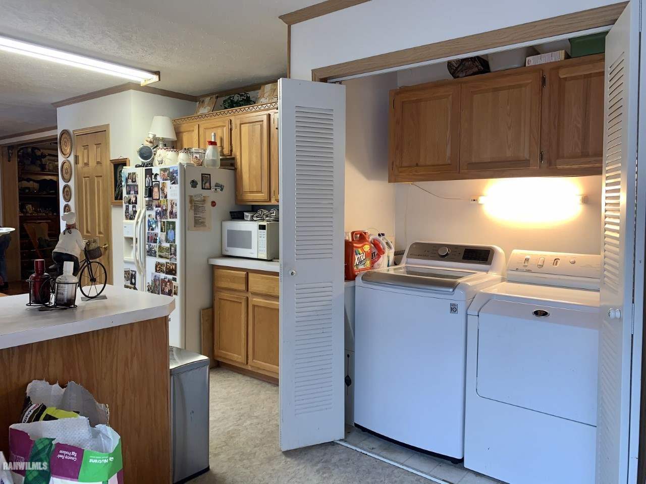 6639 Riverview Road Thomson, IL 61285 - Photo 9 of 20 a kitchen with stainless steel appliances granite countertop a refrigerator and a sink
