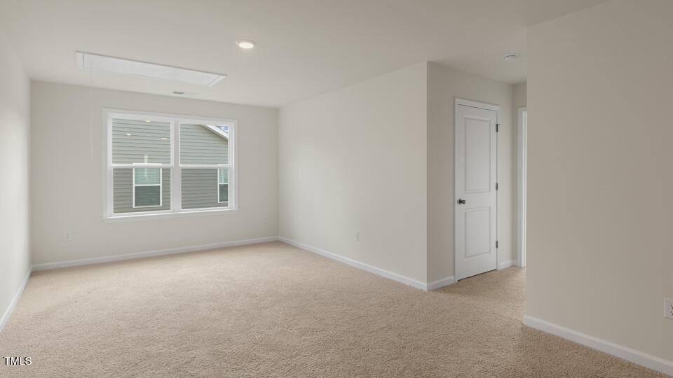166 Red Jasper Way Clayton, NC 27520 - Photo 15 of 41 an empty room with windows and closet